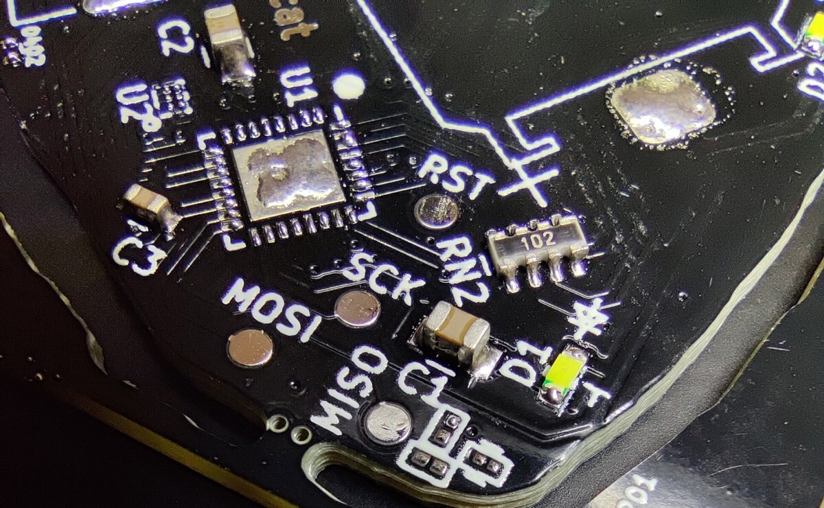 Silver solder joints on pads connecting parts to PCB. A QFN32 footprint
is left unpopulated