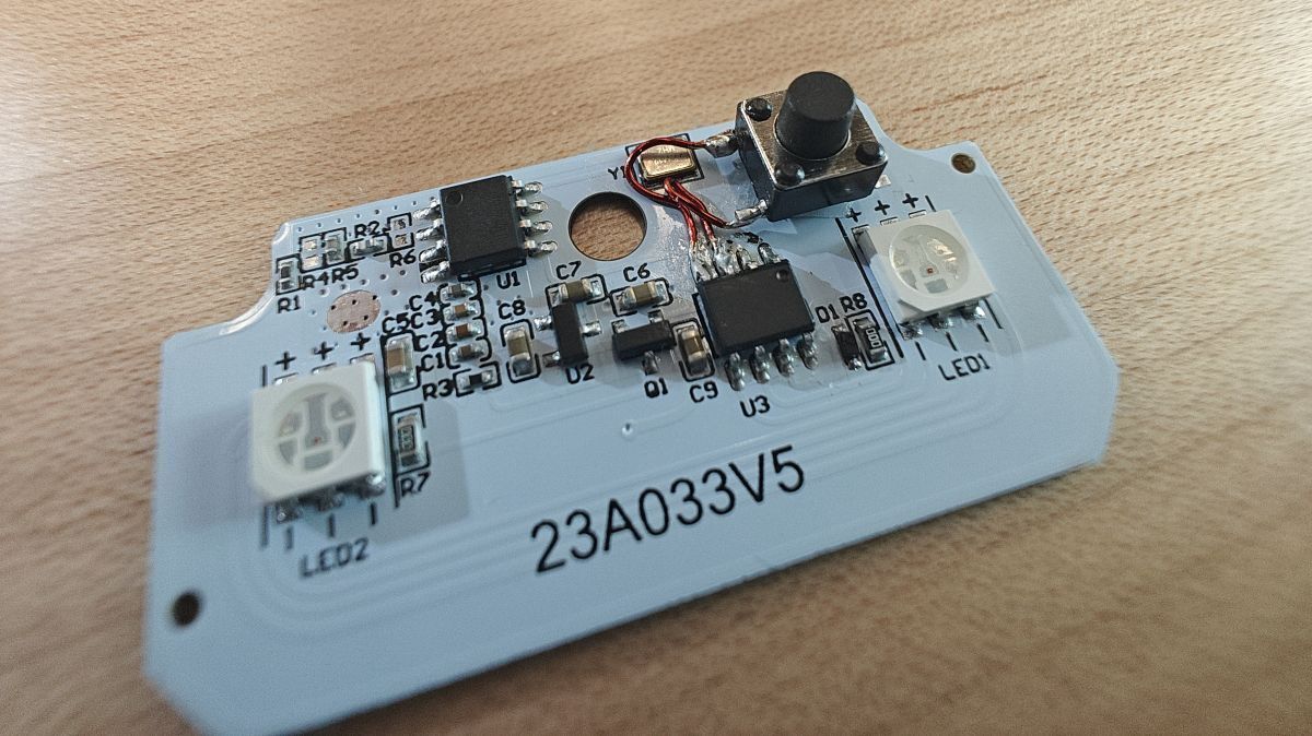 Small pushbutton soldered to said pins on PCB