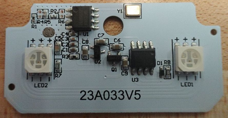 White PCB, two RGB LEDs on the left and right, circuit in the
middle