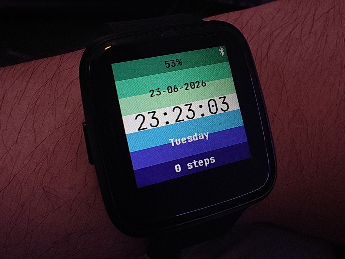 Smartwatch showing a gay pride flag watchface