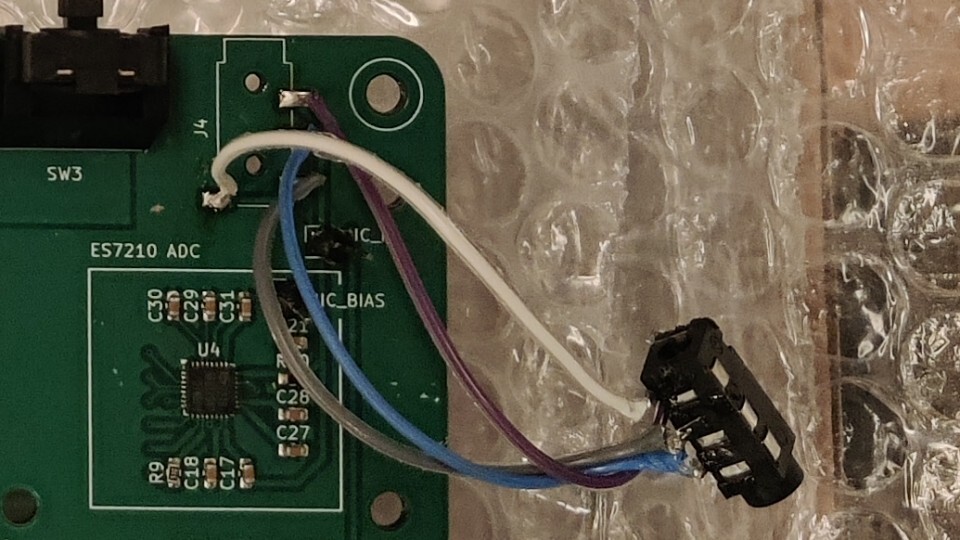 Four wires soldered between footprint and connector pads, leaving the
audio connector hanging in the air