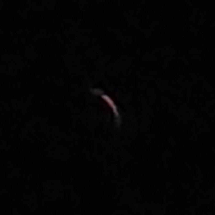 Solar eclipse through eclipse lens; a crescent
glow