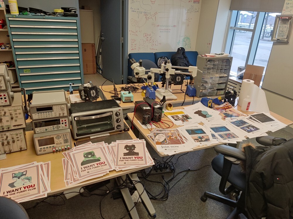 Hundreds of furry posters on a lab
workbench.