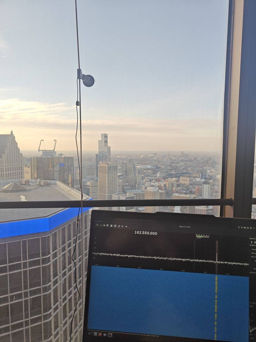 Dipole antennas attached to hotel room window, Gqrx tuned to 162.550
MHz